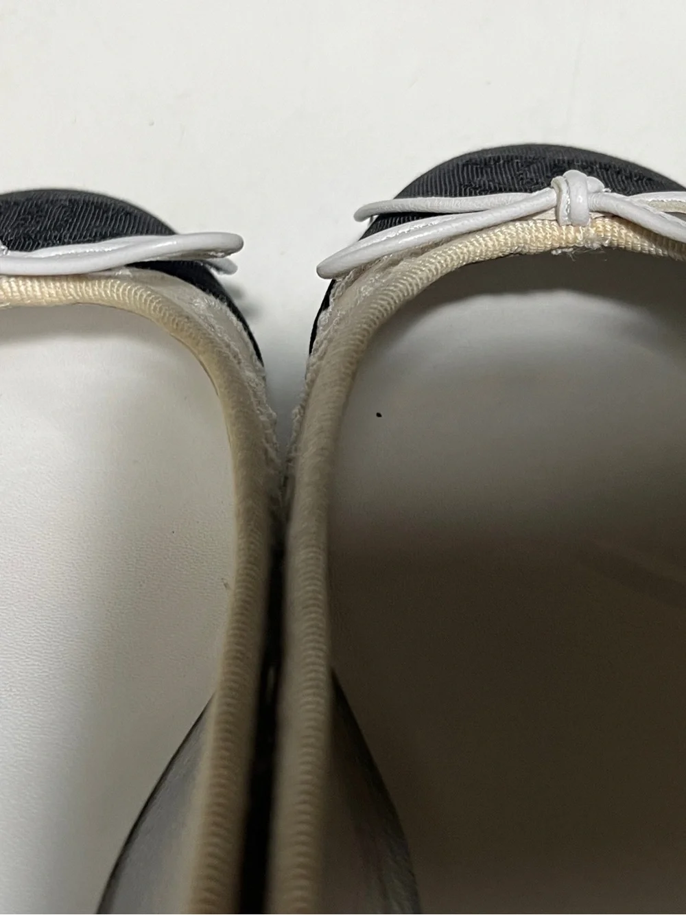 CHANEL white and Black Cap-Toe Ballet Flats with White Bow
